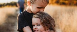 siblings hugging